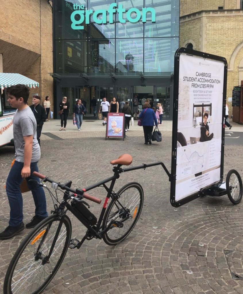 Nido student accommodation advertising on an ad bike in Cambridge