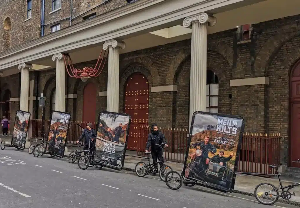 Men in Kilts premiere creative on advertising bikes in London