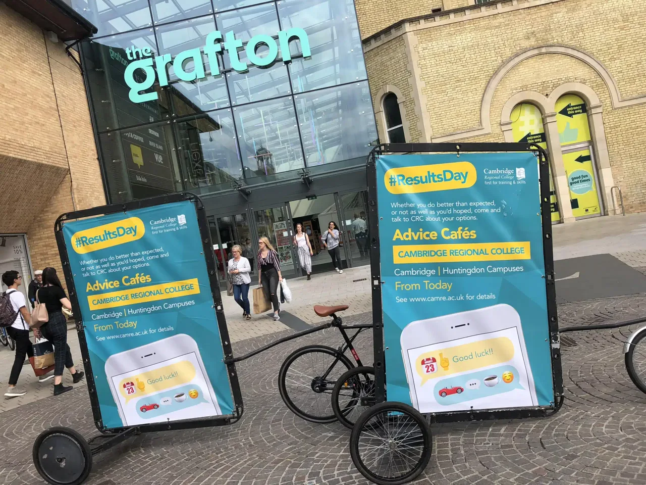 Cambridge Regional College advertising bikes outside the Grafton