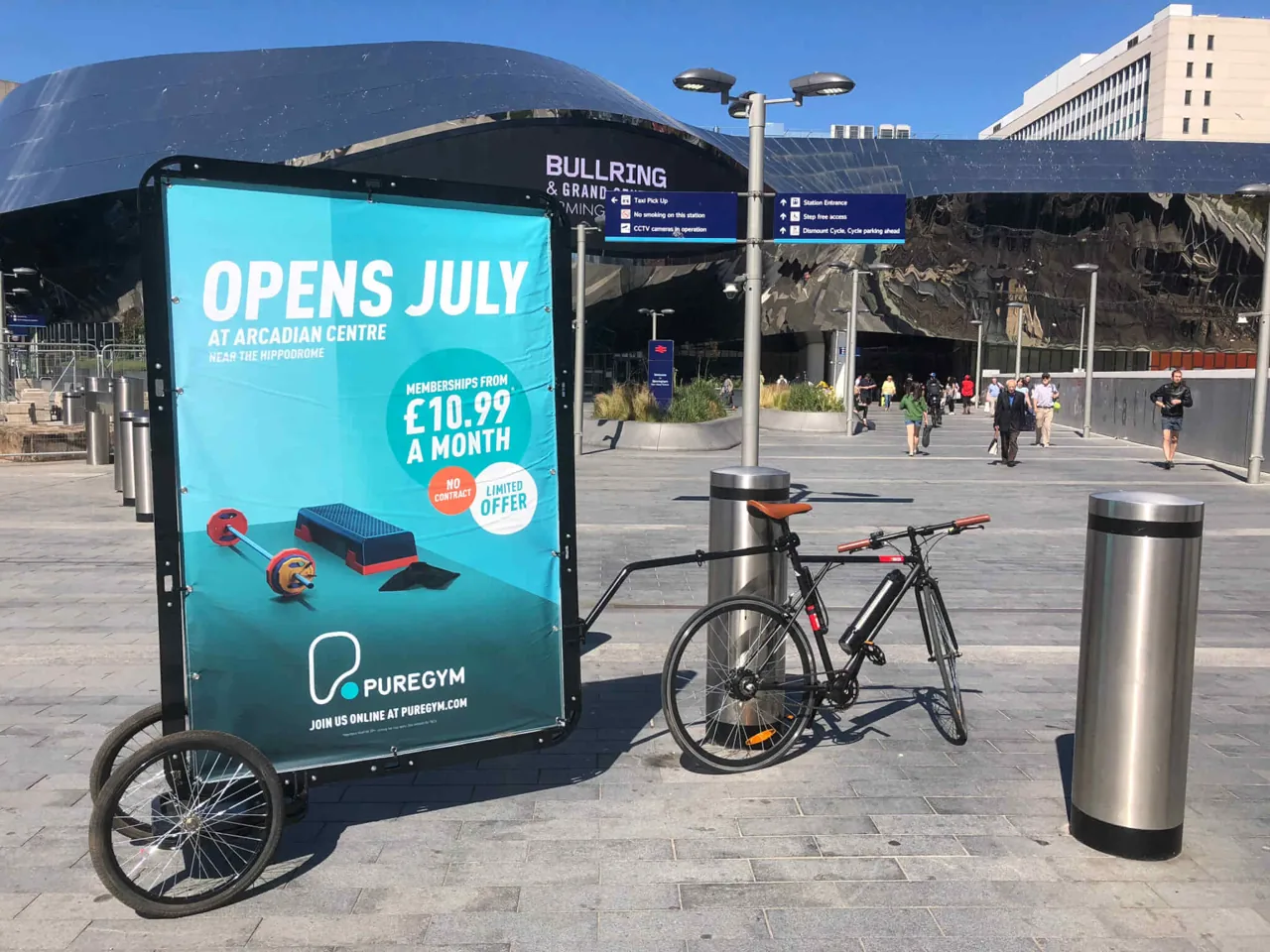 PureGym advertising bike outside Birmingham Bullring and Grand Central